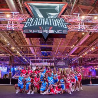 Gladiators Experience contenders wearing custom red and blue sports kits supplied by TE Sportswear